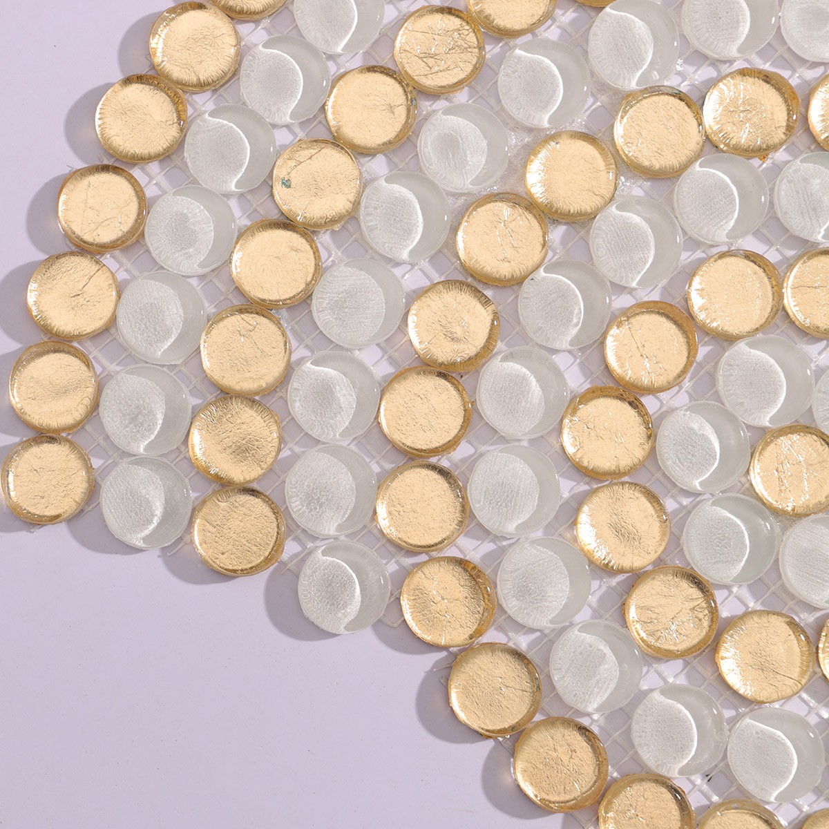 Detail image highlighting the gold and white circular mosaic tile