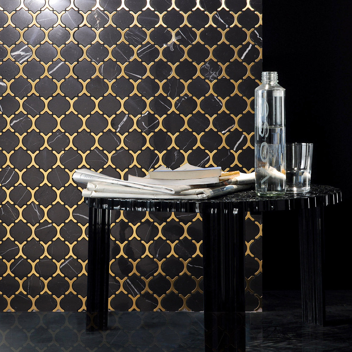 Black marble and gold stainless steel arabesque mosaic tiles on living room wall.