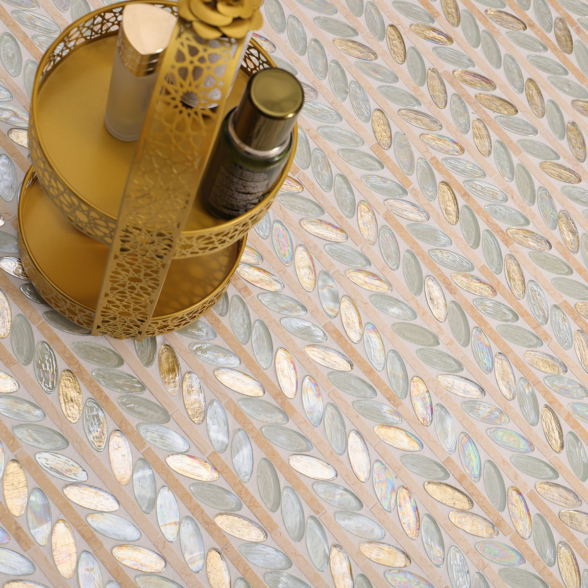Glass and Marble Oval Leaf Mosaic Tiles on the floor with skincare products