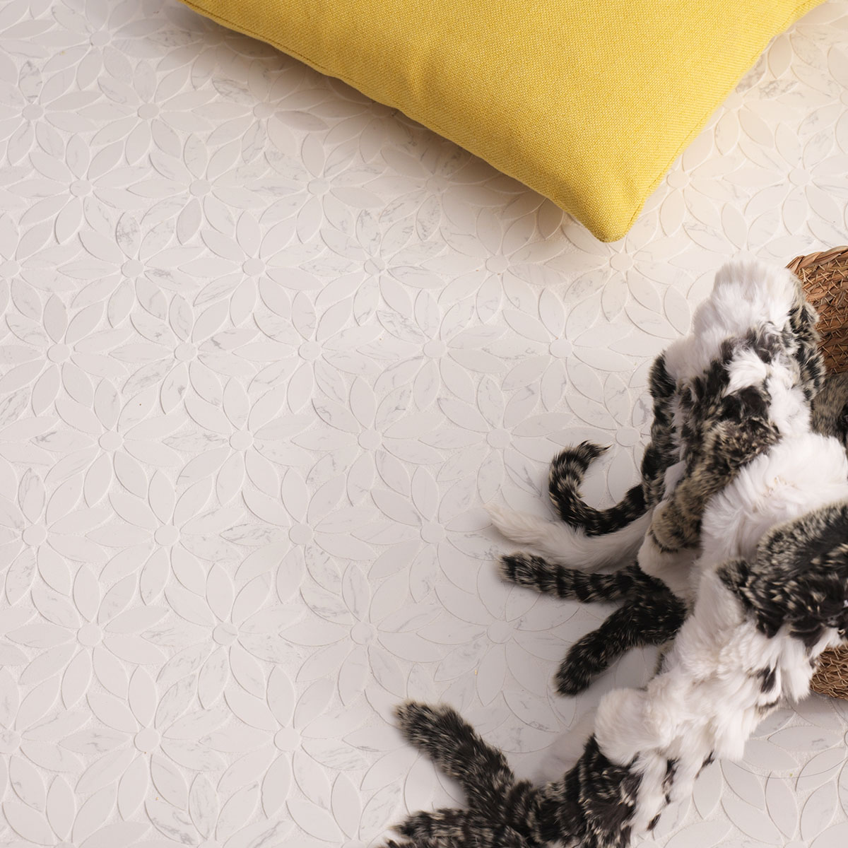 White marble mosaic tile with daisy pattern, showcasing soft textures and a cozy home setting.