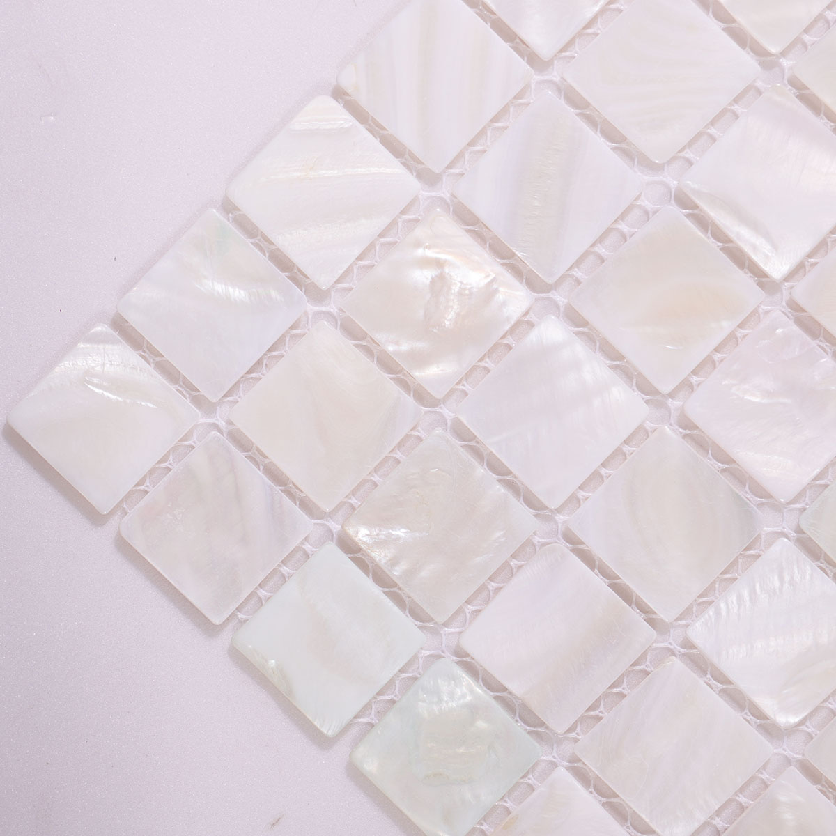 Close-up of White Natural Shell Nacre Mosaic Tile Surface