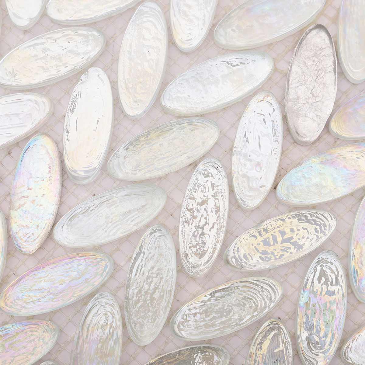 Close-up of Iridescent White Oval Glass Mosaic Tiles