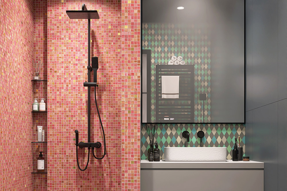 Bathroom with pink mosaic tiles in the shower room and diamond-patterned wallpaper by the mirror.