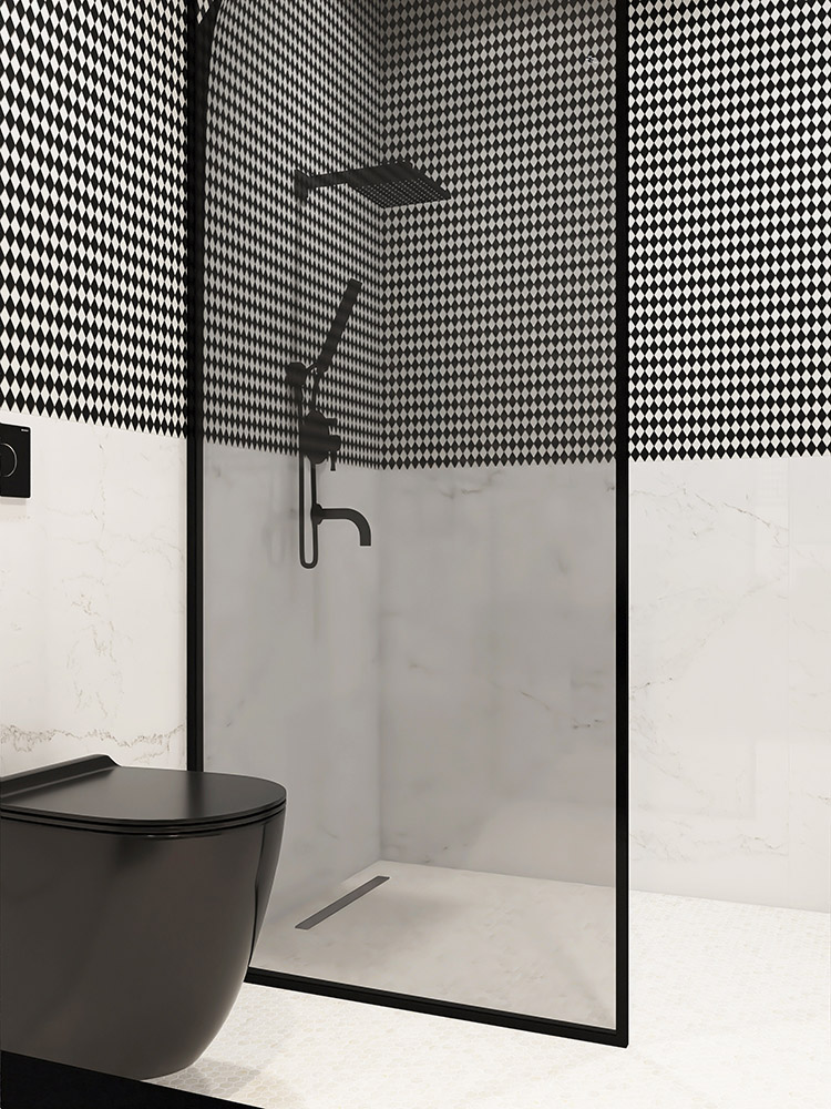 Black and white diamond mosaic tile half-wall with a glass partition between the shower and toilet.