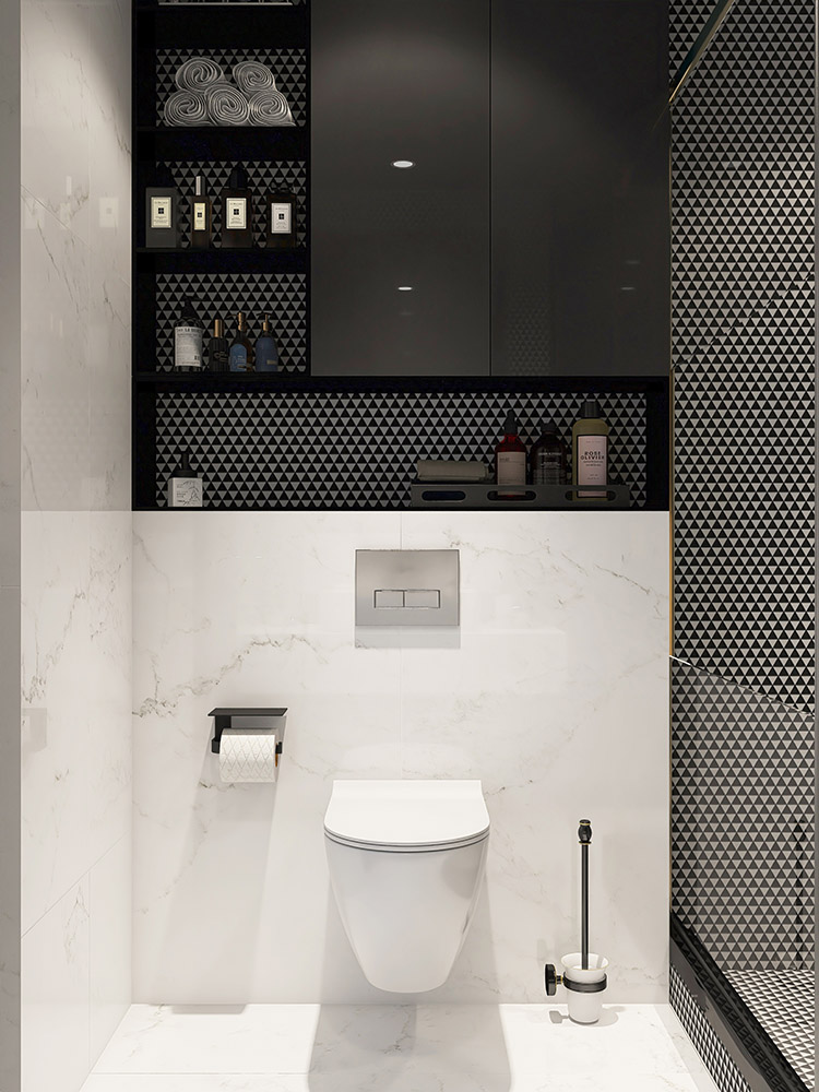Black and white triangular tiles in the bathroom niche by the toilet, next to the shower.