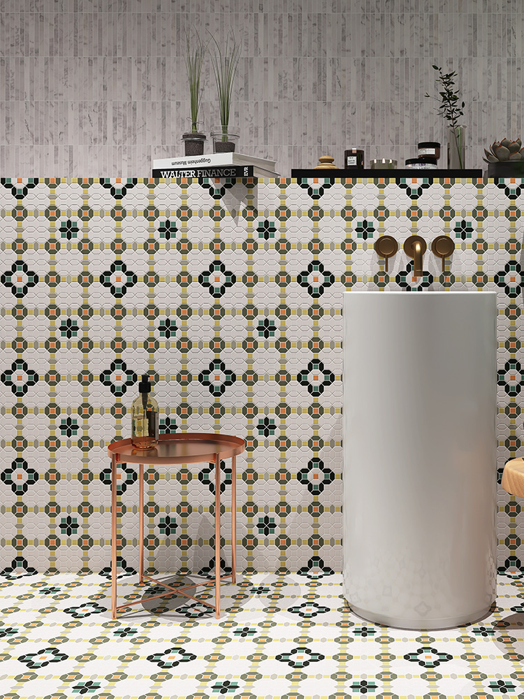 The green and white patterned glass mosaic brings a fresh and artistic vibe to the bathroom walls and floor, beautifully paired with a classic white ceramic sink.