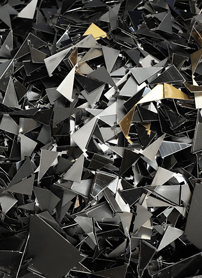 Scrap material left after pressing metal mosaic tiles.