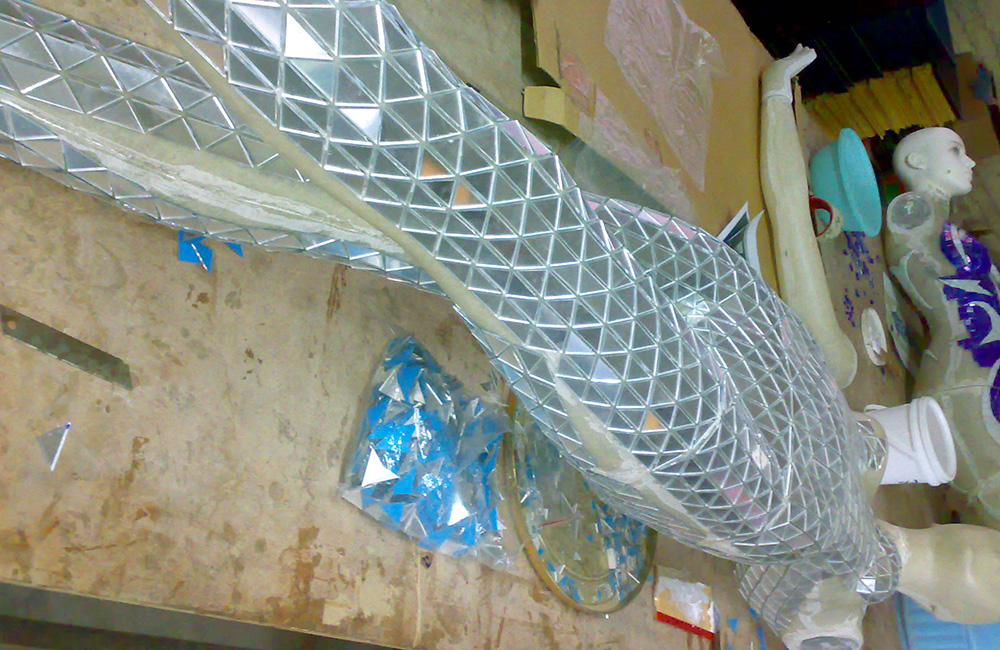 Mirror Mosaic Mannequin being made in a factory workshop.
