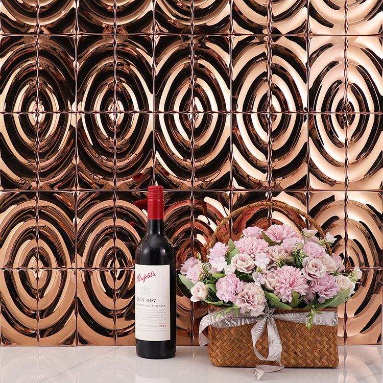 D waves stainless steel mosaic tiles on the wall with flowers and a bottle of red wine.