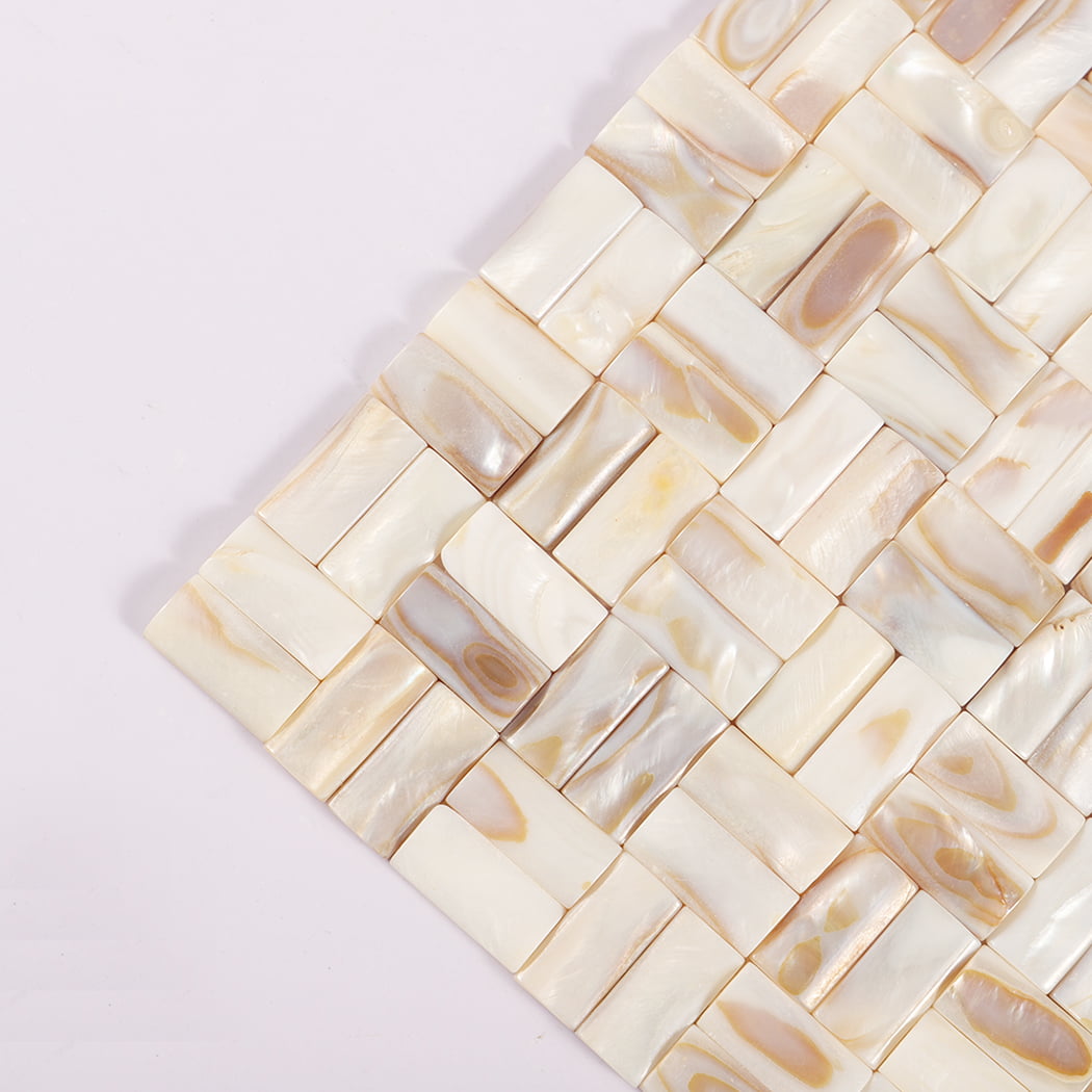 Corner close-up of 3D beige mother of pearl basket weave mosaic tile.