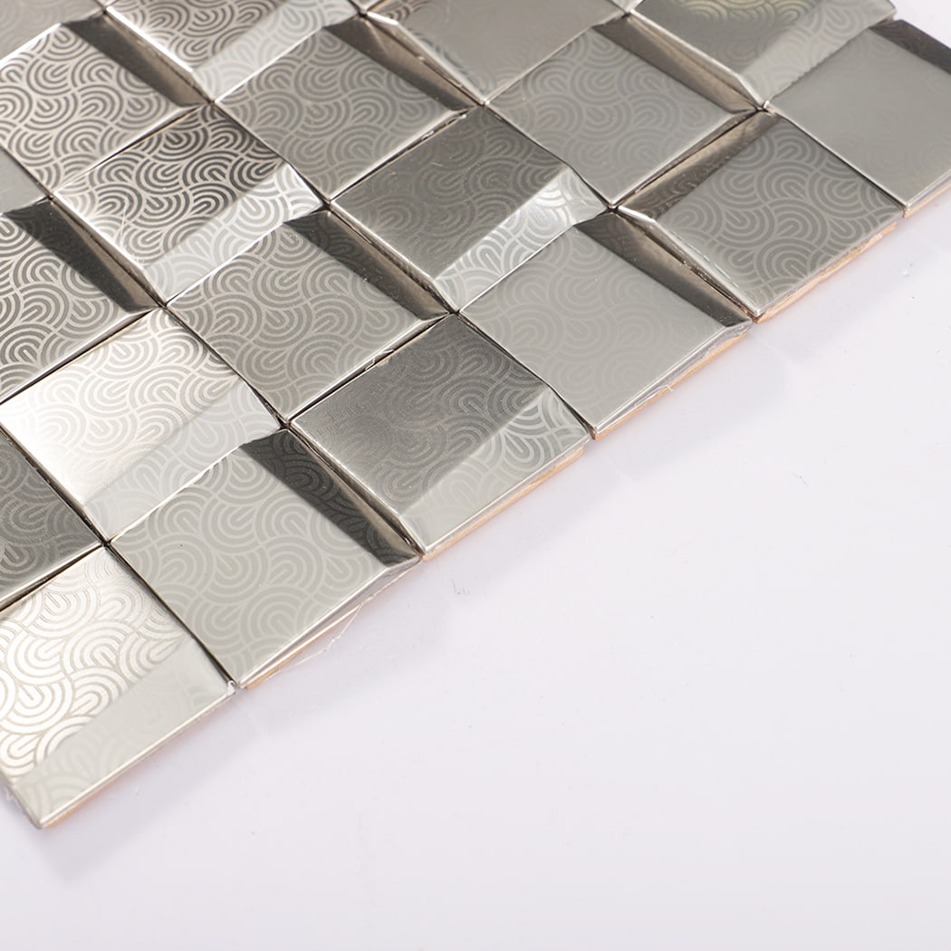 Angled edge view showing raised cube profile of 3D silver stainless steel metal mosaic tile