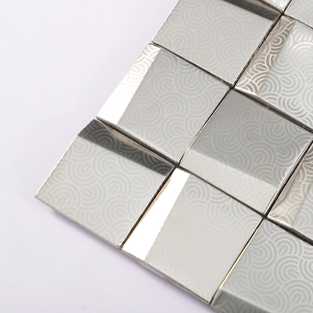 Close-up corner of embossed 3D square silver stainless steel metal mosaic tile