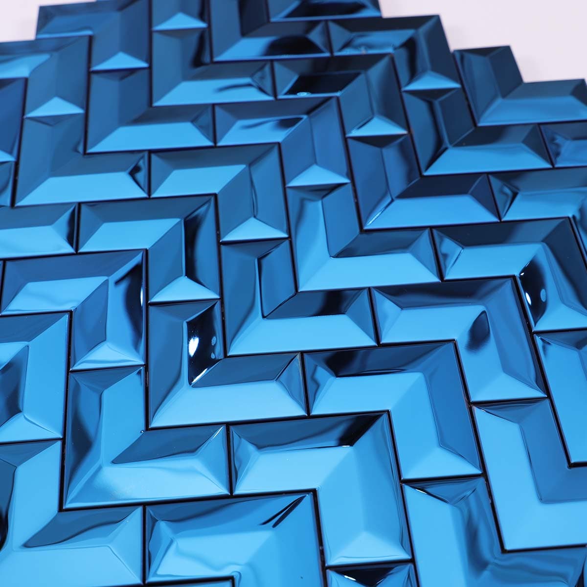 Detailed view of glossy 3D blue stainless steel chevron pattern