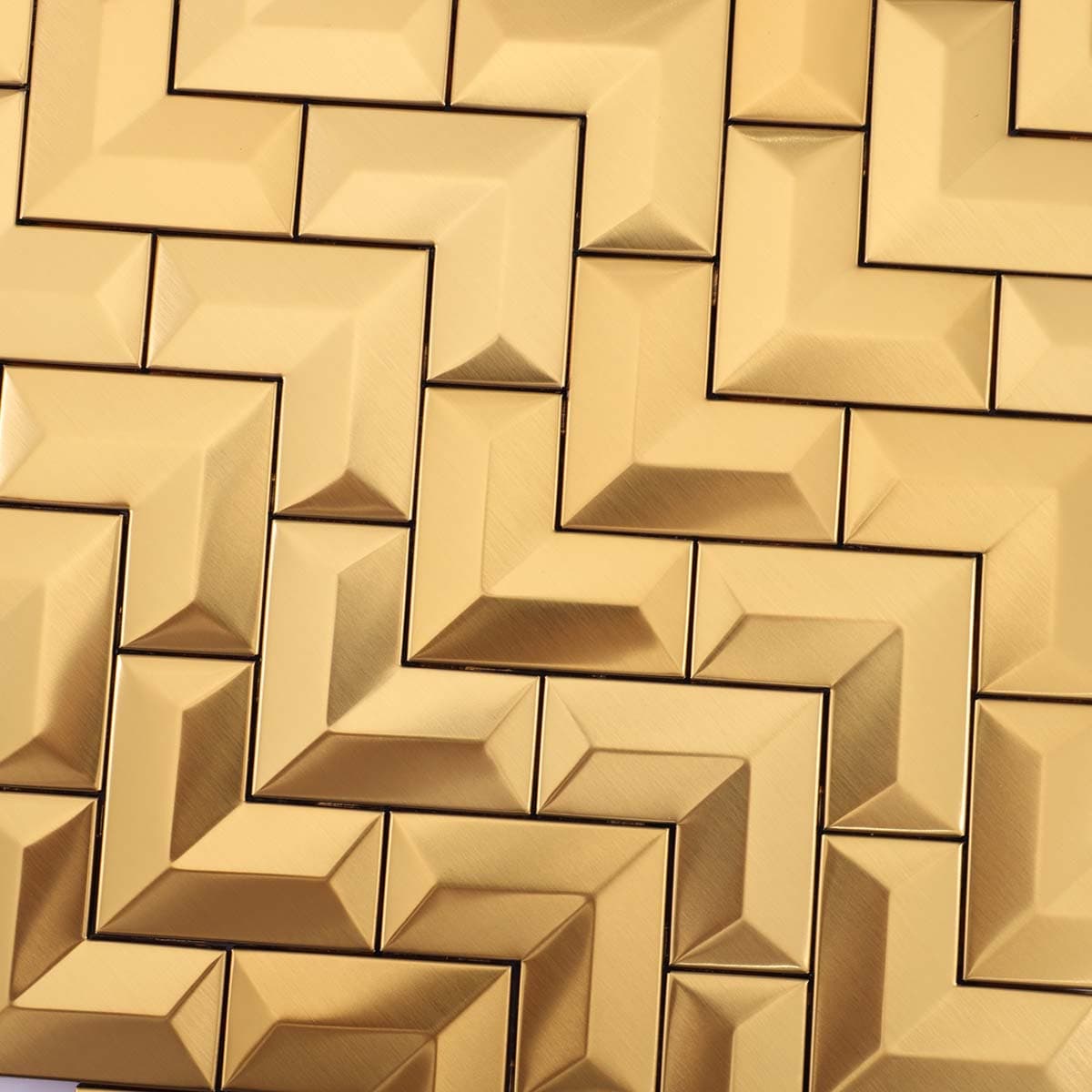 Detailed chevron pattern of 3D brushed gold stainless tile