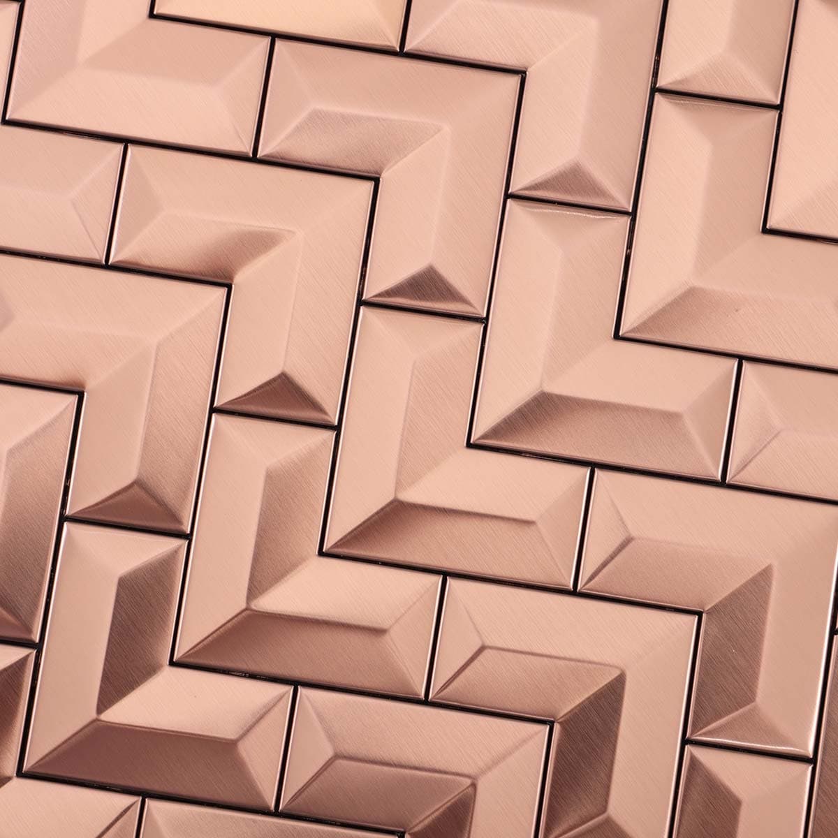Chevron pattern detail of 3D brushed rose gold stainless tile