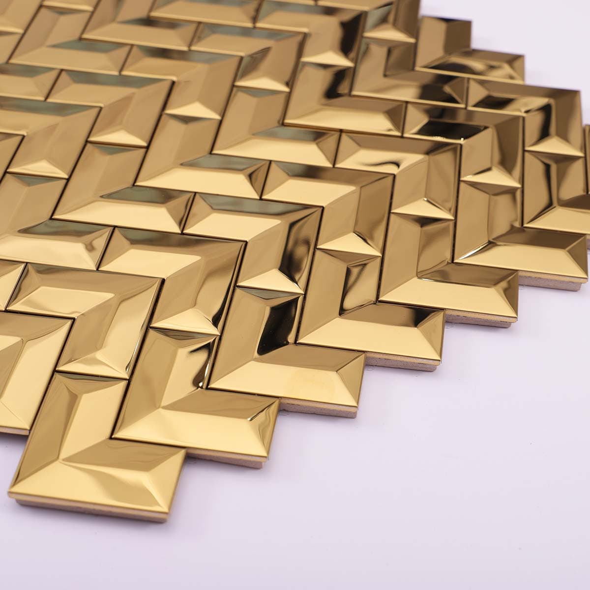 Side view of stacked gold chevron wall tiles