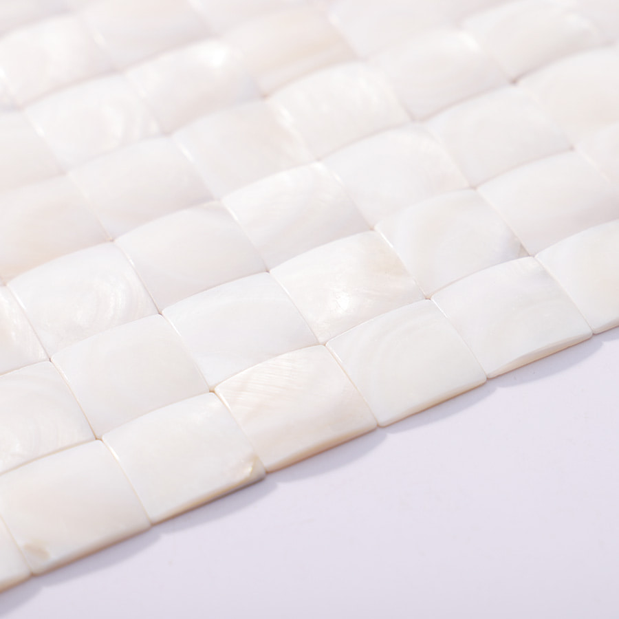 Curved edge detail of 3D white pearl mosaic tiles
