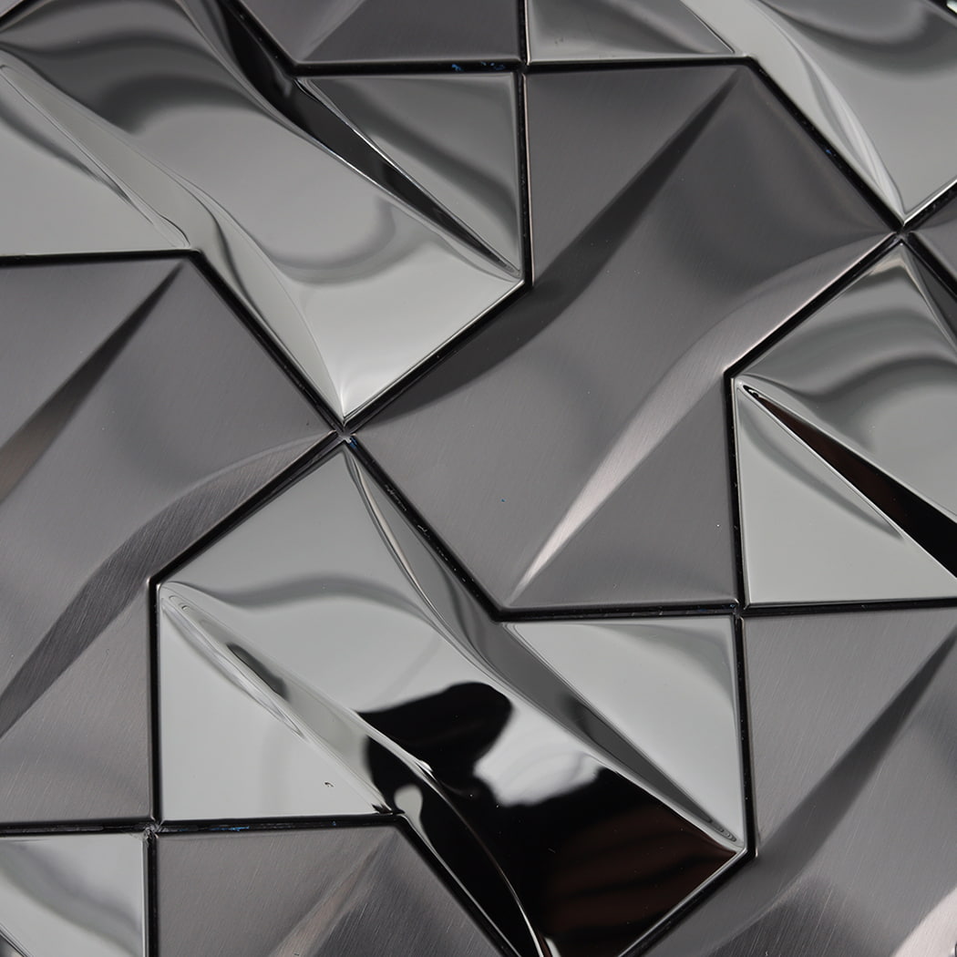 Macro view of 3D triangular textured tiles in a dark metallic gunmetal color.