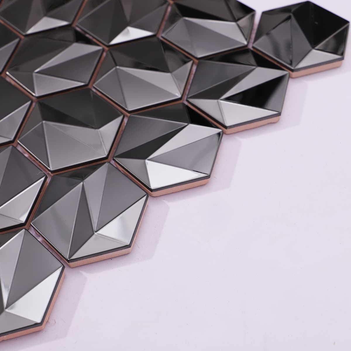 Side view showing layered thickness of 3D hex metal mosaic tiles