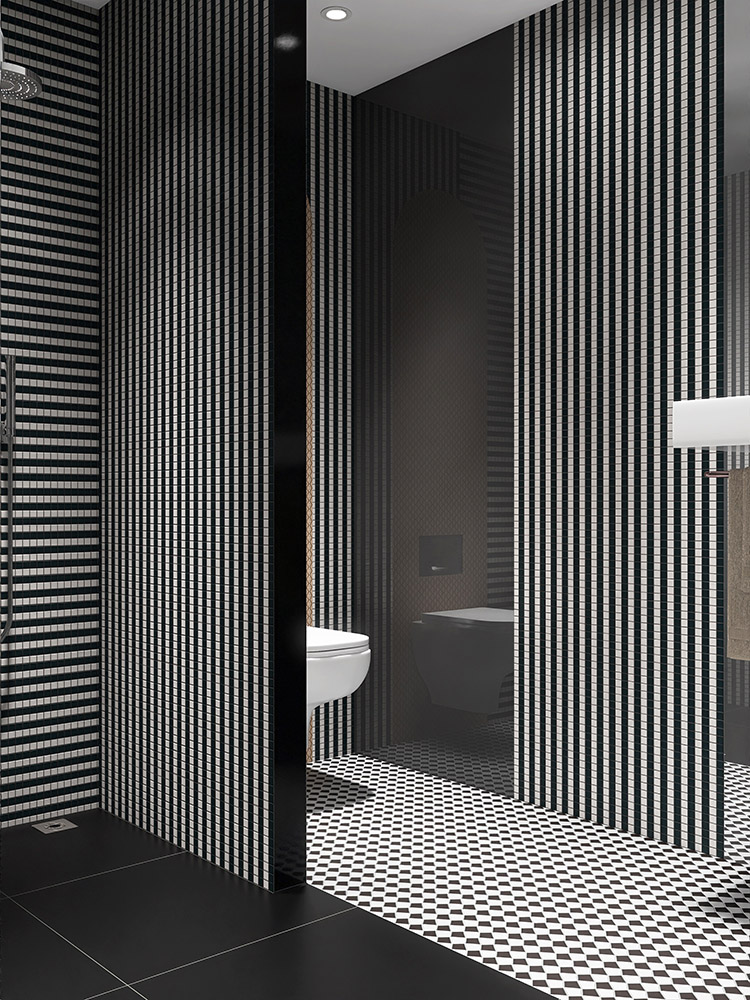 Black and white striped mosaic tiles on the wall with a partition wall in the bathroom.