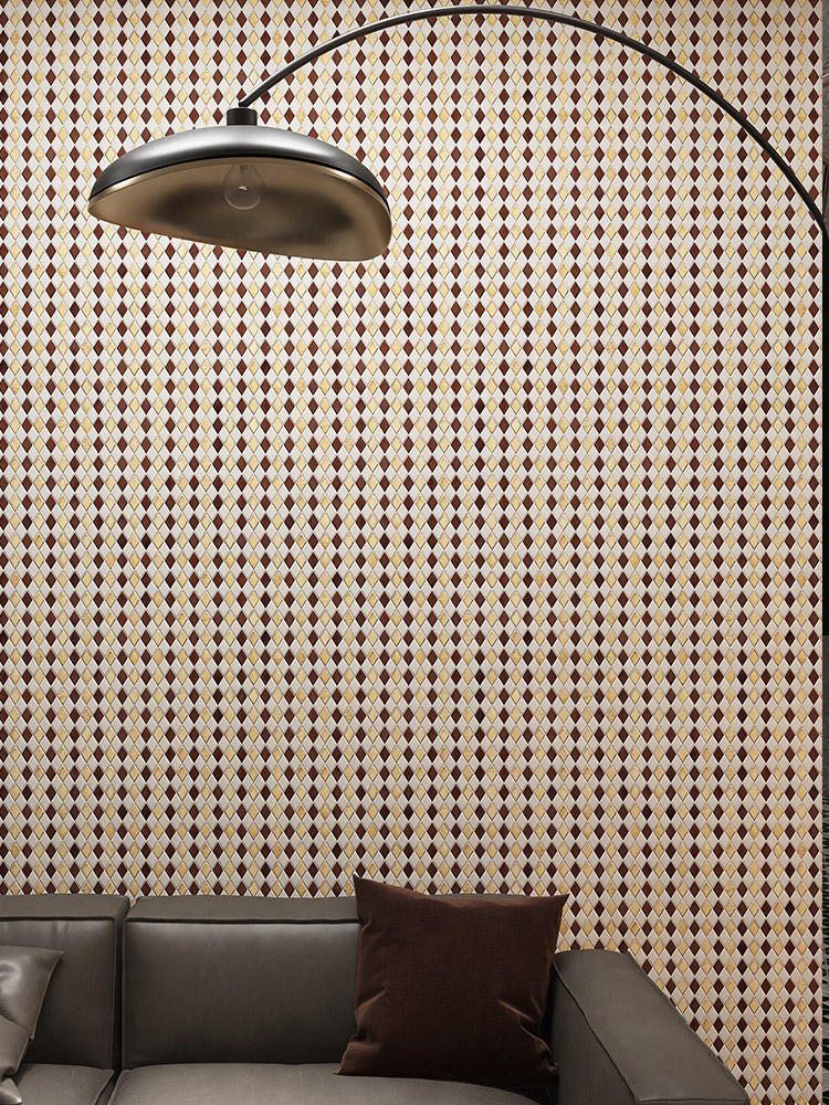 Diamond-shaped mosaic tiles on a living room feature wall with a curved floor lamp and leather sofa