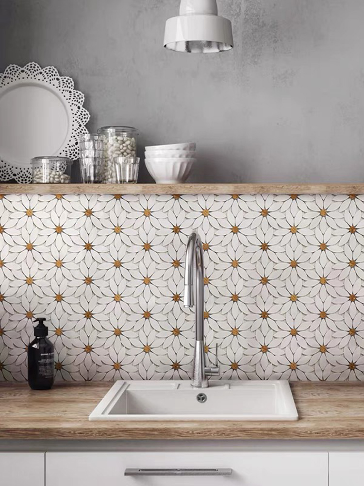 The stone sunburst mosaic on the kitchen backsplash adds a stunning focal point, paired perfectly with the warmth of the wooden countertop for a balanced, rustic-modern look.