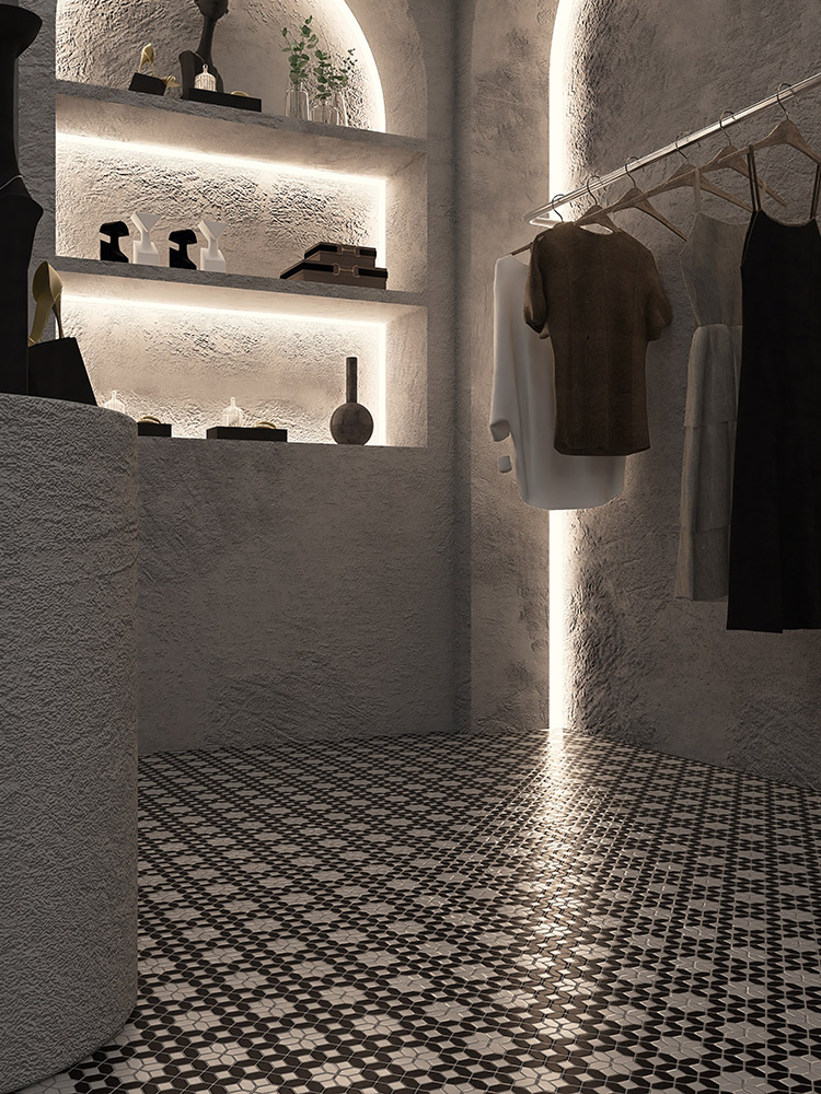 Black and white woven mosaic tile floor with LED strip lighting in a clothing store