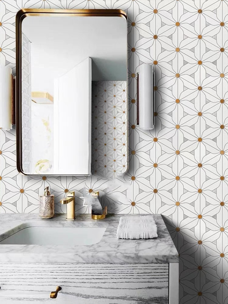 The floral stone mosaic adds an elegant touch to the bathroom sink area, beautifully complemented by a mirror and sleek white cabinet for a refined look.