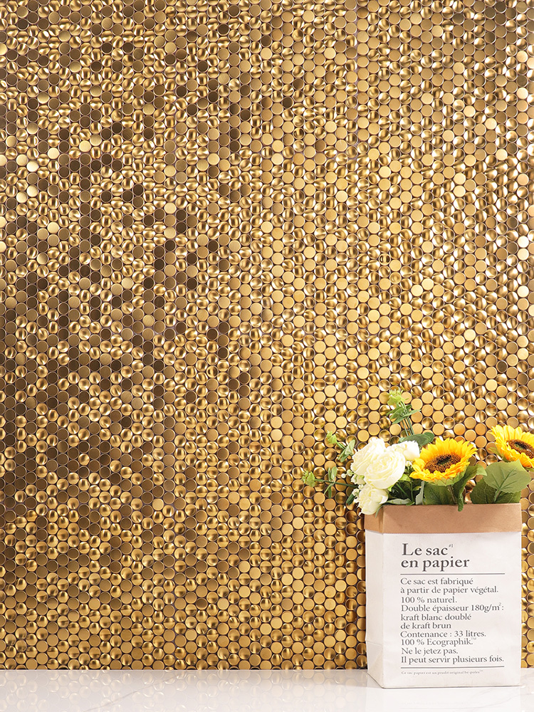 The 3D round mosaic tiles on the wall create depth and texture, complemented by sleek white floor tiles for a modern, sophisticated look.