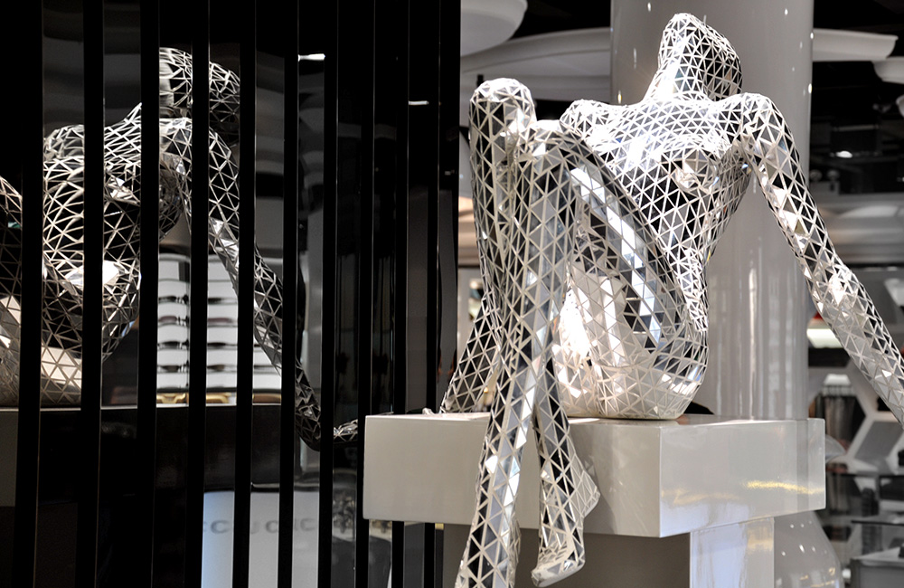 Mirror Mosaic Mannequin sitting in a store display.