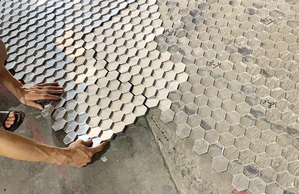 Detail of stainless steel mirrored hexagonal tiles.