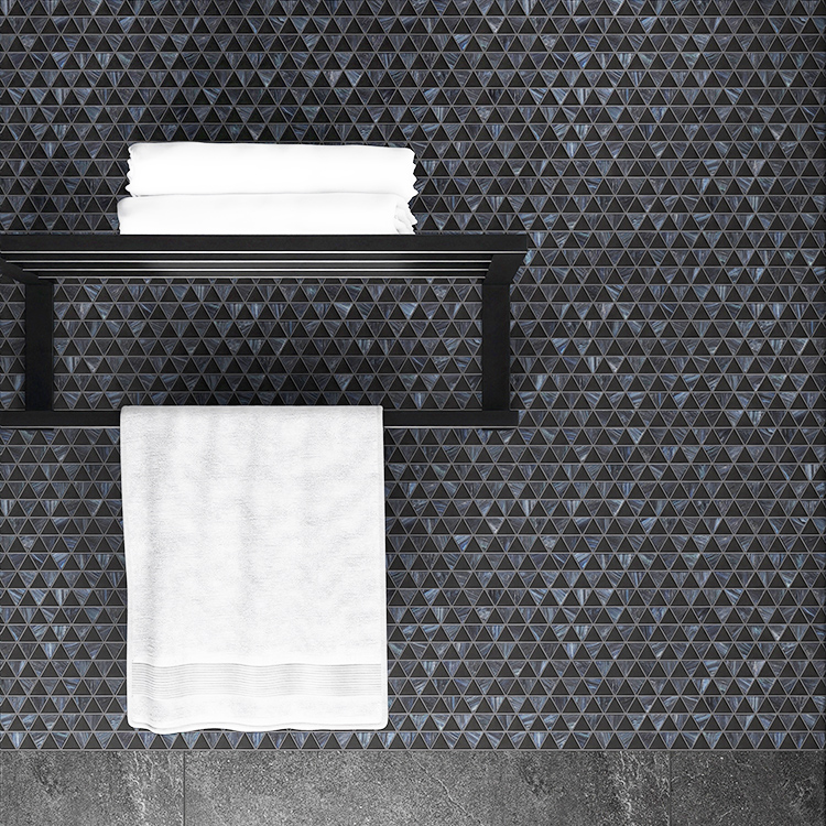 Triangle mosaic tiles in a black and grey checkboard pattern in the bathroom.
