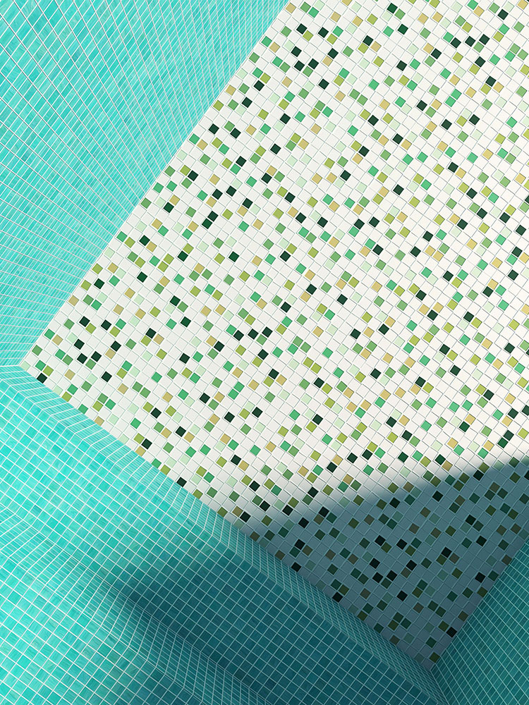 Green mixed mosaic tiles on the pool floor and blue-green mosaic tiles on the pool walls.