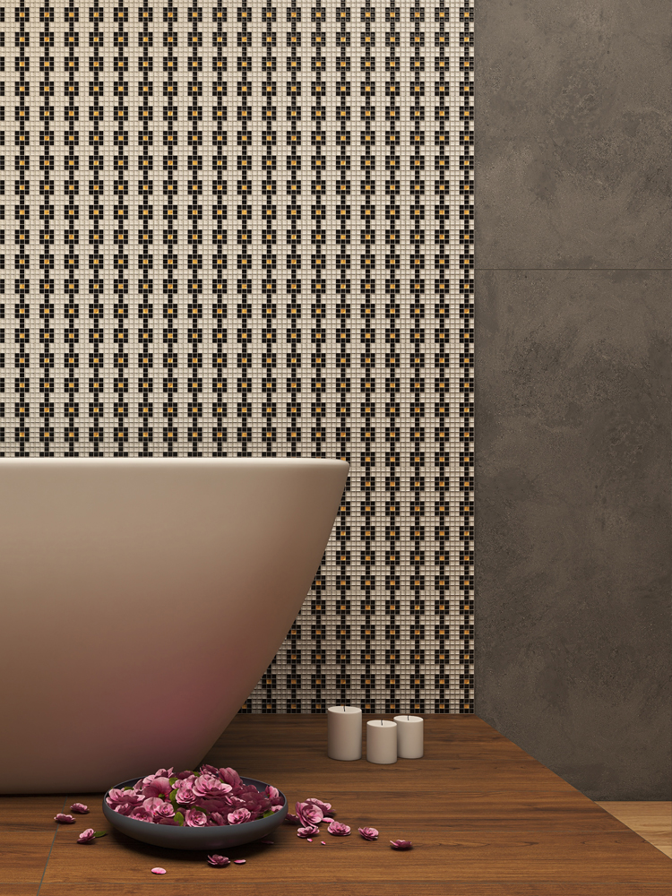 Black, white, and gold mosaic tiles in geometric patterns on the bathroom wall.