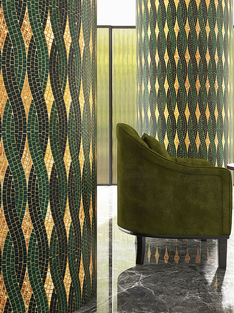 Green mosaic tiles in a woven pattern on a hotel column.