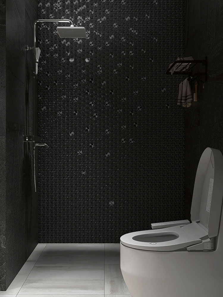 Black metal mosaic tiles on the bathroom wall with dark gray floor tiles, toilet, and shower