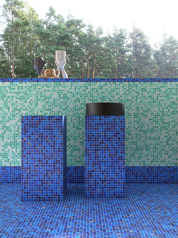 Blue mosaic tile table outside the pool