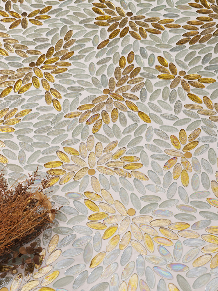 Oval gold mosaic tiles forming a bird pattern on the floor.
