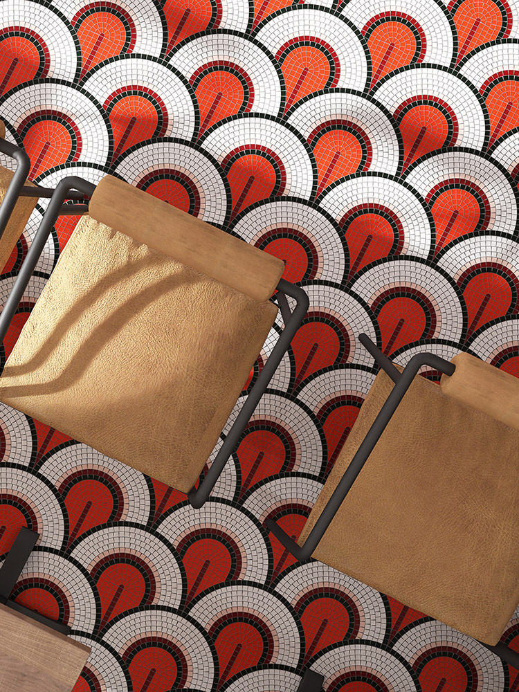 Red and white handmade mosaic tiles in a fish scale pattern on the floor.