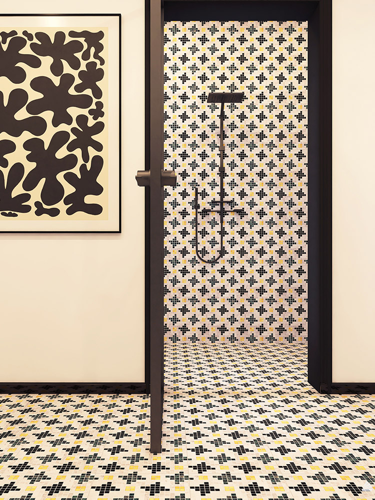 Marble mosaic tiles in a houndstooth pattern on the bathroom wall and floor