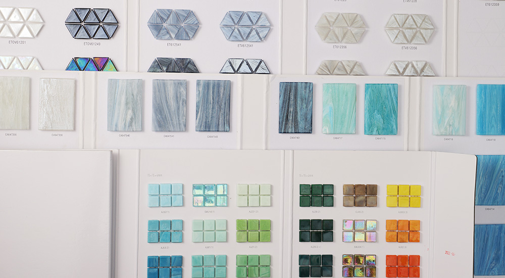 Photo of multiple mosaic tile color palettes in different shapes stacked together.