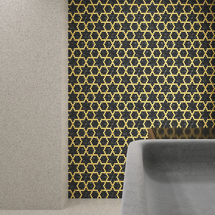 Green and gold mosaic tiles forming a star pattern in the bathroom.