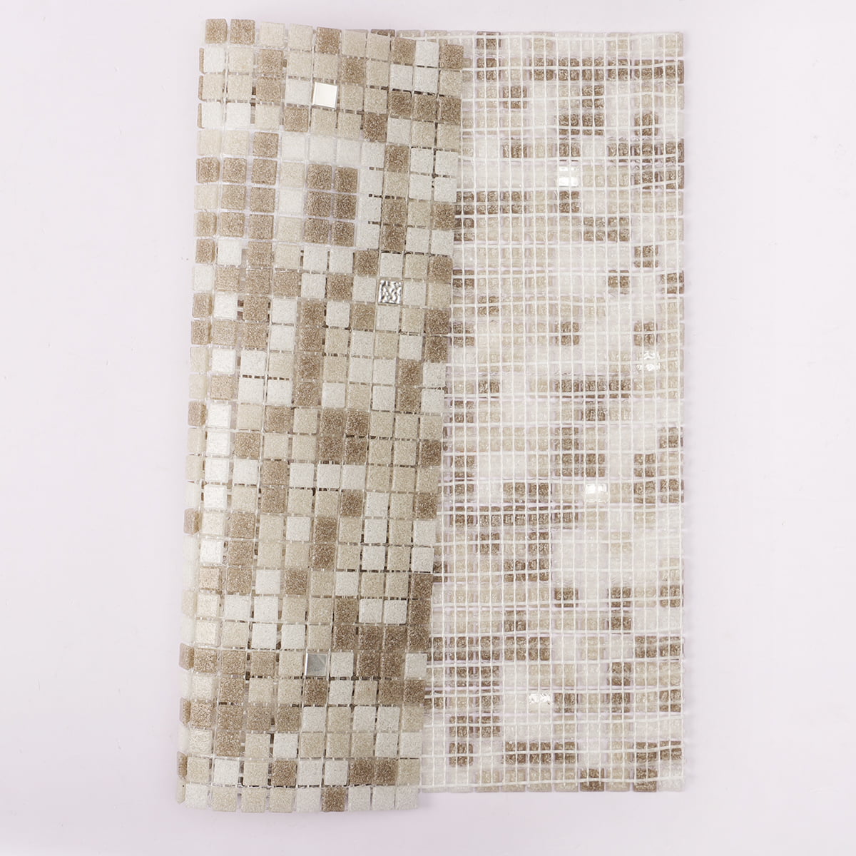 A close-up of a mosaic tile sheet with beige and white squares, highlighting the design pattern