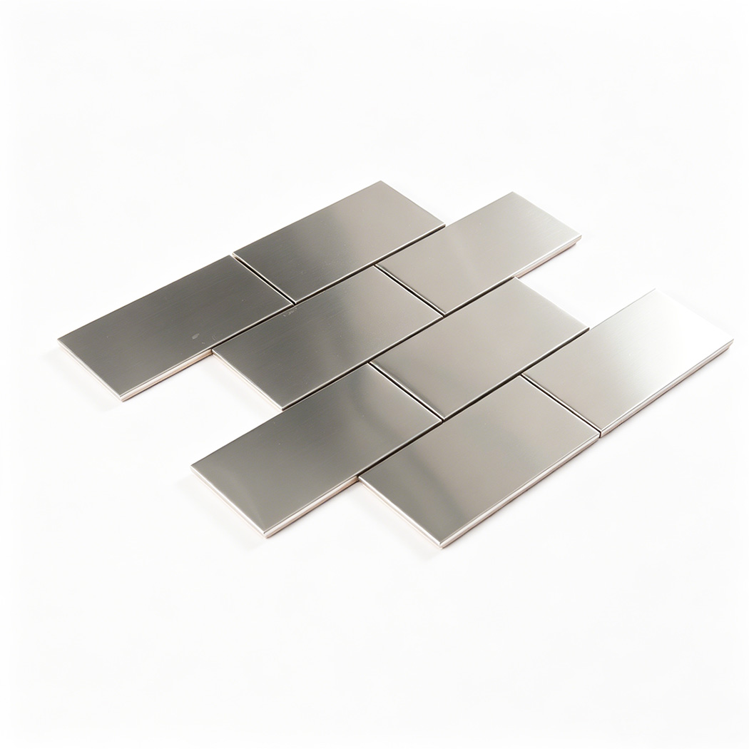 Angled view of brushed stainless steel subway tile sheet with offset layout