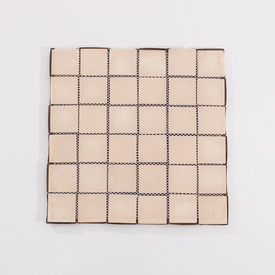 Back view of antique copper 3D square metal mosaic tile sheet with mesh backing