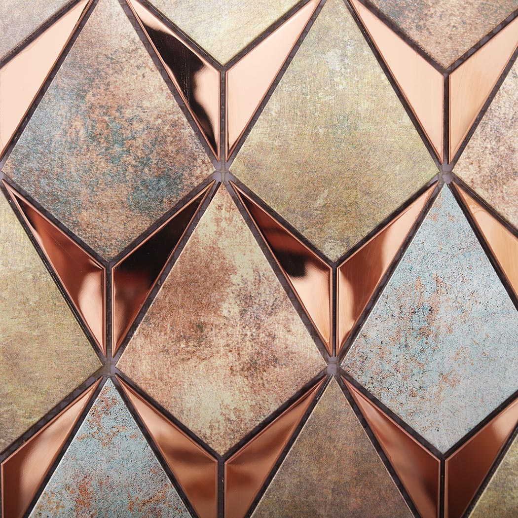 Detailed surface texture of antique diamond mosaic tiles with rose gold metal accents
