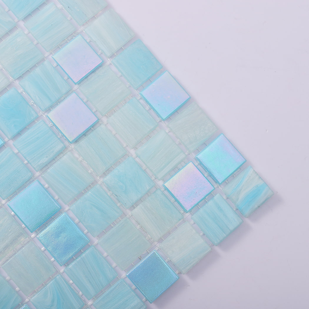 Corner closeup of aqua blue glass mosaic squares with iridescent accents