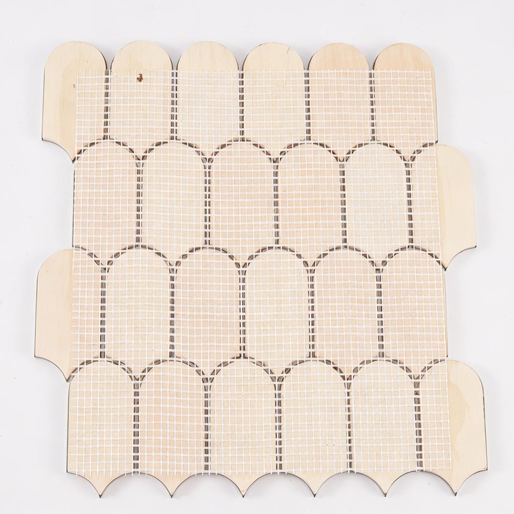 Back view of green arch metal mosaic tile sheet with mesh mounted backing