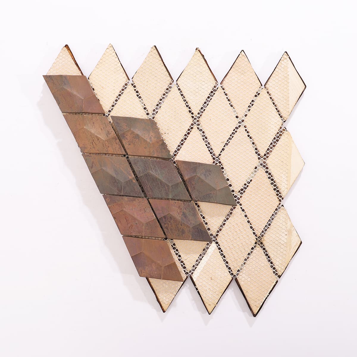 Backside of 3D diamond copper mosaic tiles, showing structural support