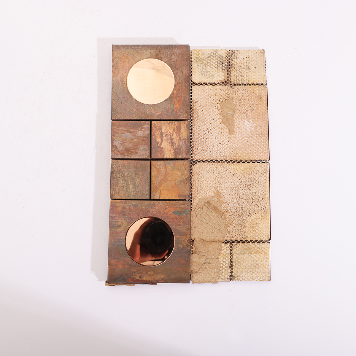 Backside view of the antique copper and stainless steel mosaic tiles.
